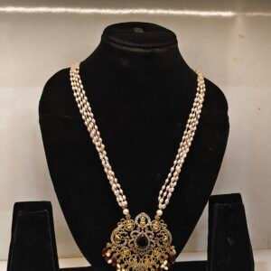 traditional pearl haram with a gold-finish pendant adorned with colored stones